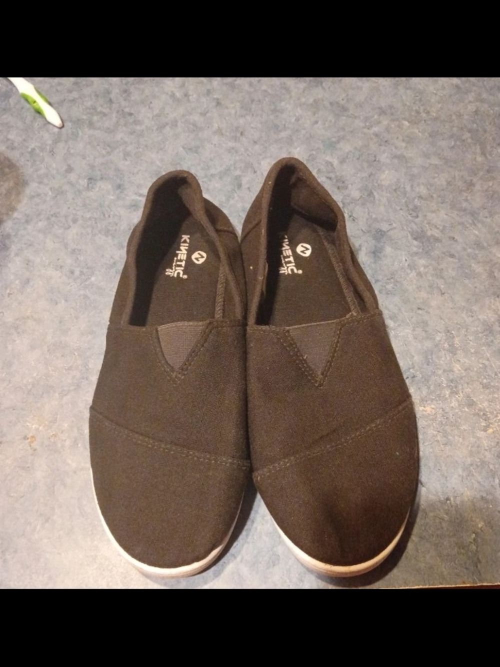 Kinetic black slip-on casual shoes